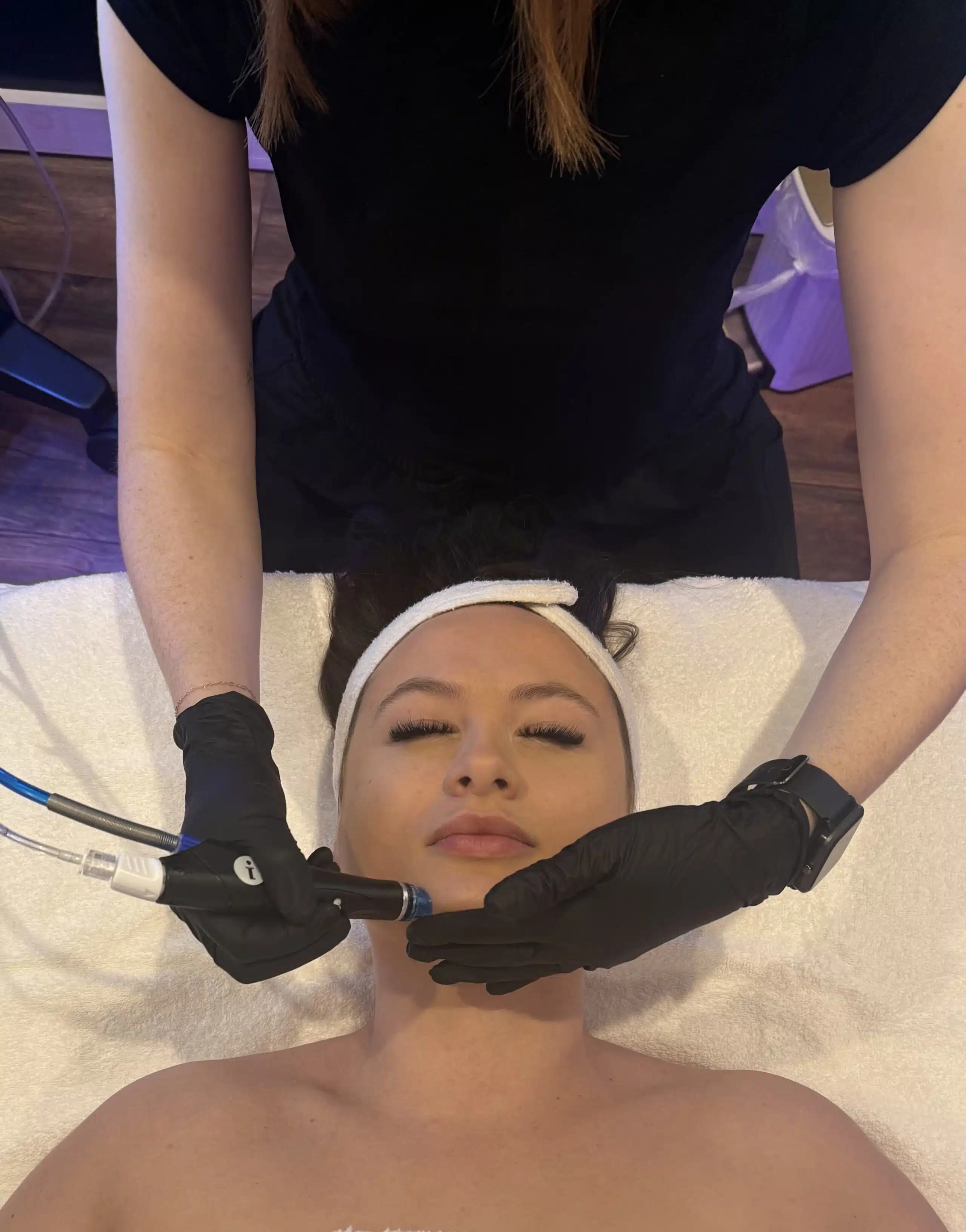 Woman getting facial at 212 Med Spa